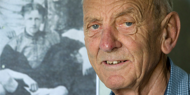 Mr David Braithwaite pictured in front of a photograph dating back to 1903 of his uncle, Private Jack Braithwaite, who was executed by the British Army on a charge of mutiny in October 1916.