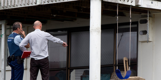 Police near the swing and the chain, at the house at Mangawhai Heads. Photo / Brett Phibbs
