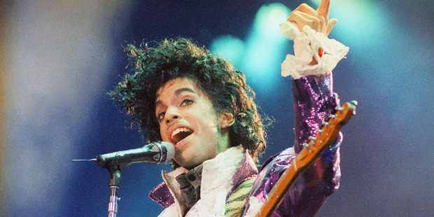 Prince performs at the Forum in Inglewood, California in 1985 at the height of his Purple Rain fame. Photo / AP