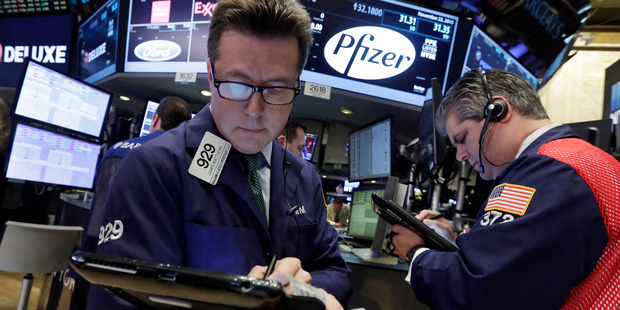 Traders James Matthews, left, and John Panin work at the New York Stock Exchange. File photo / AP