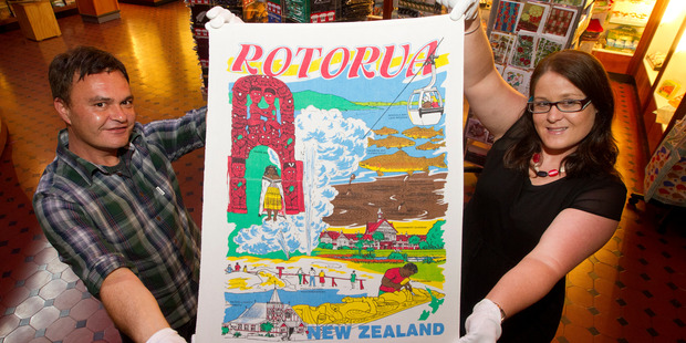 Tharron Bloomfield and Kathy Nichols hold up Boyhood Memories, one of the tea towels from Richard Hill's collection. Photo/File