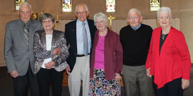 Three Dannevirke couples celebrate their 60th wedding anniversaries at St John's Anglican Church in Dannevirke yesterday. John Burn (left), Jill Burn, Jim and Judy Kernaghan and Robin and Margaret Larsen. Photo / Christine McKay