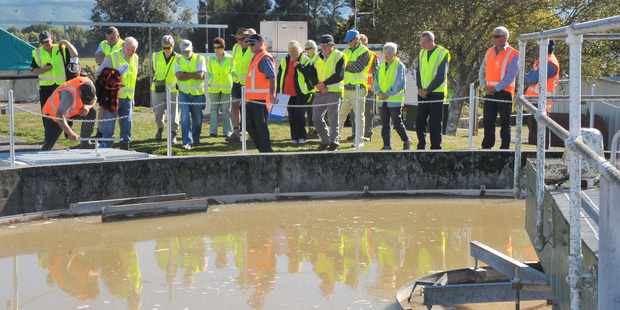 Operations manager Garry Baker (centre) explains the workings of the plant to visitors. PHOTO/CHRIS KILFORD