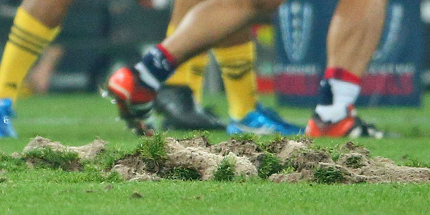 A general view of the surface of AAMI park after large divots of turf were ripped up during a scrum. photo / Getty