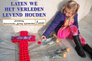 Residents and school children in the Dutch town of Wierden laid poppies on the graves of airmen shot down over Holland. Pictured, Kees Kroon's 6-year-old granddaughter.