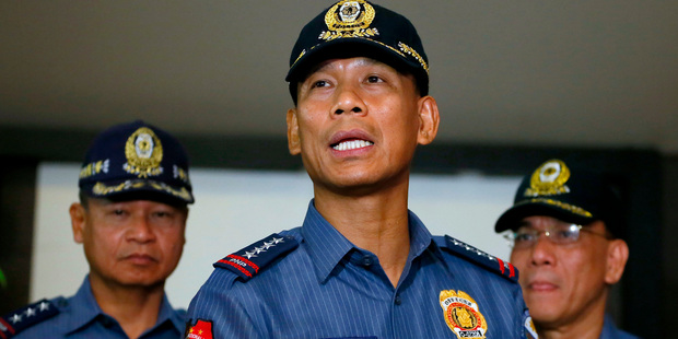 Philippine National Police Director General Ricardo Marquez reads the joint statement of the military and police on the beheading of Canadian hostage John Ridsdel. Photo / AP