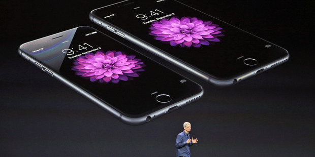 Apple chief executive Tim Cook launching the iPhone 6. Photo / AP