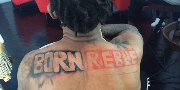 Iggy Azalea says she stopped her fiancé Nick Young getting this tattoo on his back. Photo/Twitter