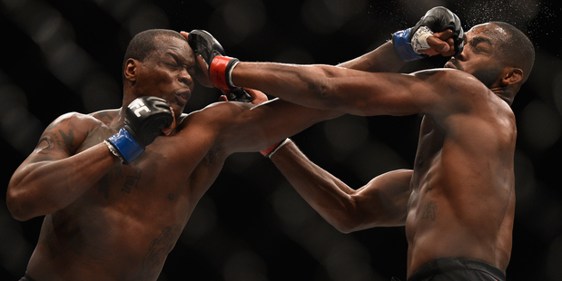 Ovince Saint Preux (left) punches Jon Jones in their interim UFC light heavyweight championship bout during UFC 197. Photo / Getty Images