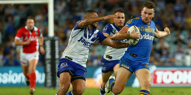 Clinton Gutherson of the Eels (R) scored a try after two forward passes were not picked up by officials. Photo / Getty