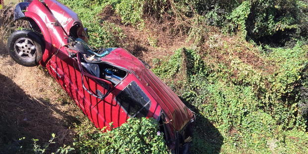The car recovered from a Hamilton stream. Photo / Belinda Feek