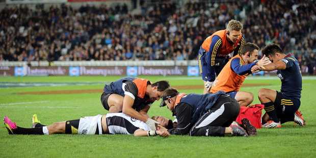 Willie Le Roux of the Sharks and Jason Emery of the Highlanders. Photo / Getty Images