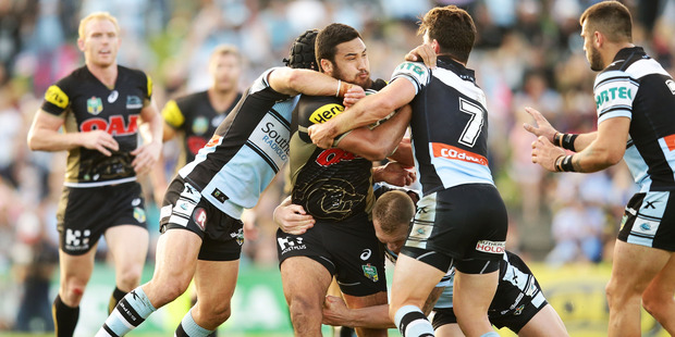 Kiwi Panther Peta Hiku is wrapped up by the Sharks. Photo / Getty Images
