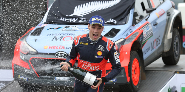 Outstanding rally driver Hayden Paddon celebrates the first win for a Kiwi at elite level. Photo / AP