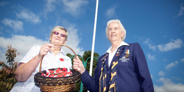 Tauranga RSA president Heather Waldron and Faye Cairns, a therapist at Radius Care, dedicate a flag pole at the Althorp Village hospital in Pyes Pa prior to the village's annual Anzac Day service