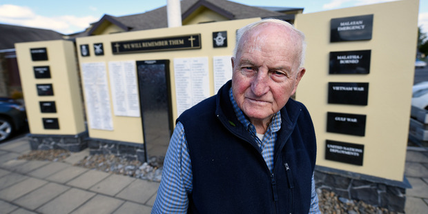 Army veteran Bob Swale, 90, stands at the Tauranga RSA's Remembrance Wall. The wall includes names of local service members who died in the First and Second World Wars.