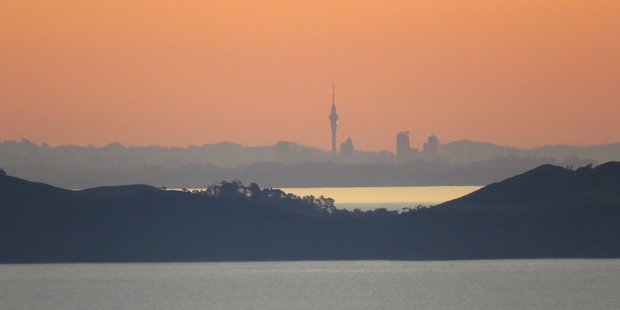 Sunset on the Sky Tower taken from the top of Kirita Hill on the Coromandel Coast.