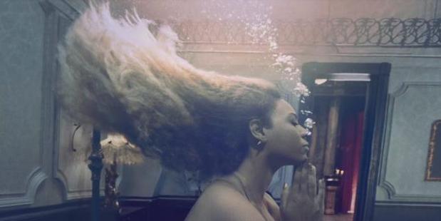 Beyonce swims underwater in one scene from her Lemonade music video. Photo / HBO