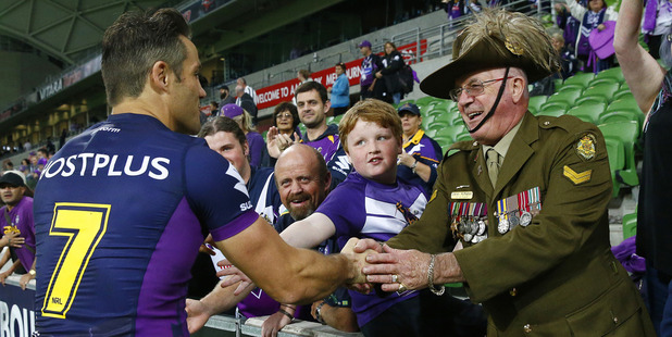 Cooper Cronk shakes the hand of a service man after the win over the Warriors. Photo / News Corp Australia