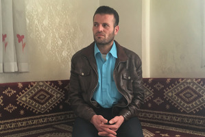 Anas al-Shurqat receives guests at the funeral of his brother, Zaher al-Shurqat, in Nizip, Turkey.