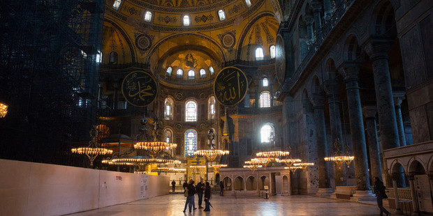 Tourists inspect the inside of the Hagia Sofia mosque in the Sultanahmet district of Istanbul. Photos / Bloomberg