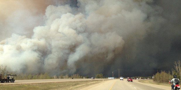 Residents try to flee the fire threatening the town of Fort McMurray in Alberta Canada. Photo / Twitter
