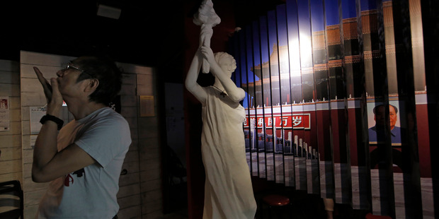 A man looks at the exhibits in the June 4th Museum in Hong Kong. It is the world's only museum about the Chinese Government's brutal 1989 crackdown on student protesters in Beijing. Photo / AP