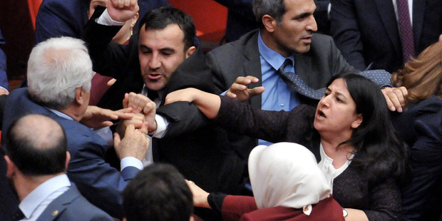 Turkish MPs argue and push each other on the assembly floor in Ankara, Turkey. Photo / AP