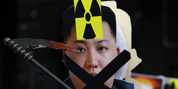 A placard of North Korean leader Kim Jong-Un during a protest in South Korea. Photo / Getty Images