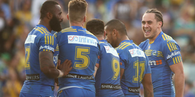 Eels centre Brad Takairangi celebrates with teammates after scoring a try against the Canberra Raiders. Photo/Getty