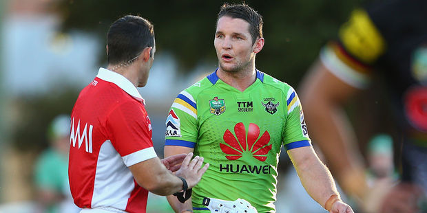 Referee Gavin Reynolds speaks to Jarrod Croker of the Raiders. Photo / Getty