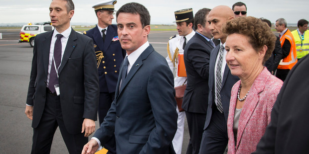 His Excellency Manuel Valls (Centre), Prime Minister of France arrives on Sunday afternoon at Auckland Airport for the first visit by a French Prime Minister since 1991. Photo / Greg Bowker