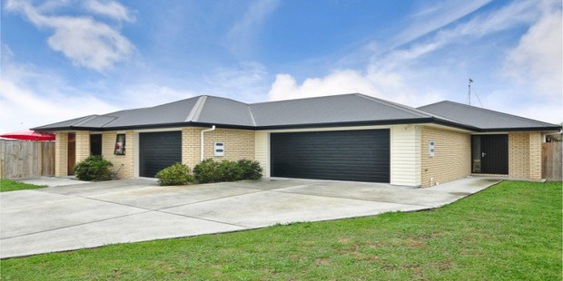 A property with a four-bedroom home and two-bedroom apartment attached on a 675sq m section in Rototuna's Aquila Crescent had a CV of $690,000, but sold for $895,000. Photo / Supplied
