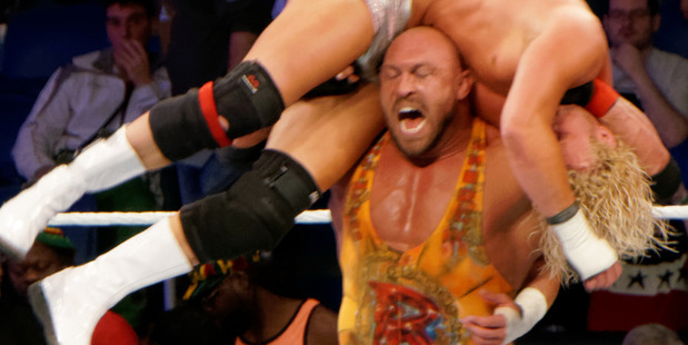 Ryback hoists Dolph Ziggler on his shoulders to deliver his Shell Shocked manoeuvre. Photo / WWE Raw
