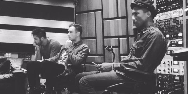 Photo of members of Six60 in the studio with Pharrell.