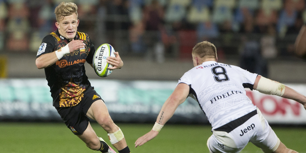 Damian McKenzie's build and skills are reminiscent of Mac Herewini. Photo / Photosport
