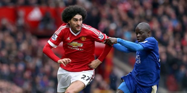 Manchester United's Marouane Fellaini, left, and Leicester City's N'Golo Kante chase the ball during their English Premier League soccer match. Photo / AP.