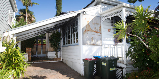 The villa was damaged in a fire last year where a woman died. Photo / Nick Reed