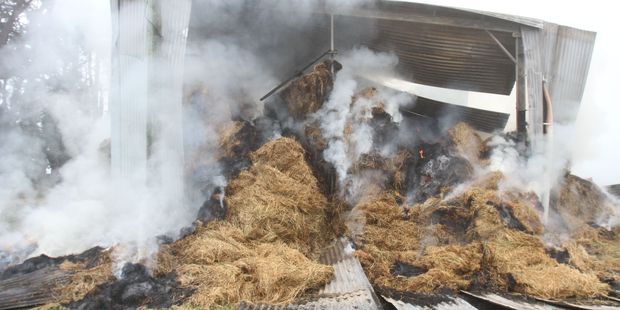 An overnight barn fire on Rutland Rd in Carterton, still burning this morning. PHOTO/ANDREW BONALLACK