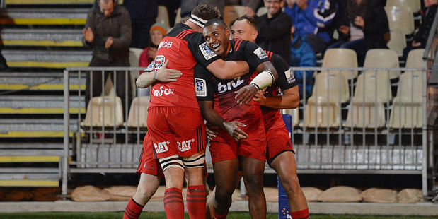 Wing Jone Macilai (C) scored three of the Crusaders six tries en route to a convincing victory over the Reds. Photo / Getty