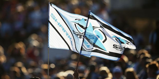 Young Sharks fans fly flags before a game. Photo / Getty