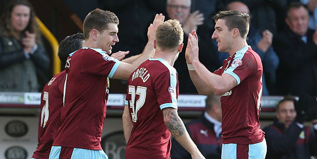 Sam Vokes of Burnley celebrates with team mates after he scored against QPR. Photo / Getty