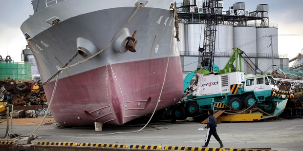 A ship lies stranded on a wharf after the 2011 tsunami that devastated Japan.
