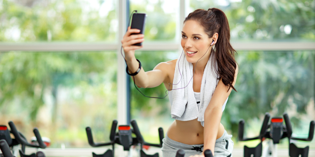 Judging by all the photos on social media, the gym selfie isn't going away any time soon. Photo / iStock