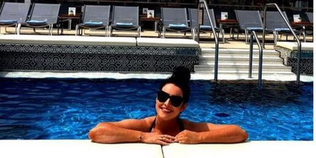 Patricia Greig in the onboard pool for an early morning dip. Photo / Instagram.com/nzhtravel, Patricia Greig