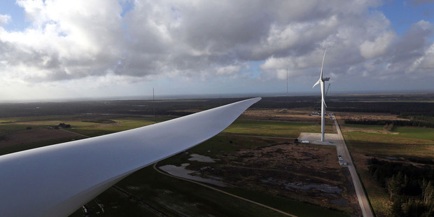 The giant blade of a Vestas V136 points towards a Vestas V164 wind turbine during operational testing at Osterild. Photo / Bloomberg