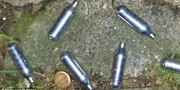Witnesses say two men and one women had nitrous oxide canisters thrown at them. Photo / Metropolitan Police