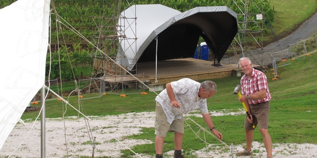 Workers put up the VIP tent ahead of tonight's UB40 concert at Kainui Rd Vineyard north of Kerikeri. Photo / Peter de Graaf