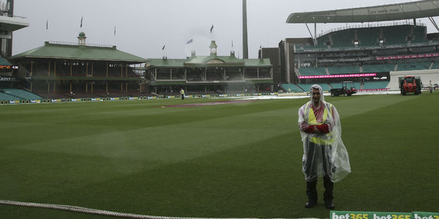 Rain left only security guards on the field. Photo / AP