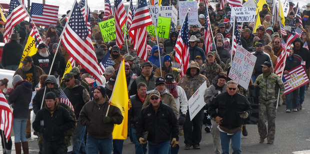 Protesters march in support of an Oregon ranching family facing jail time for arson in Burns, Oregon. Photo / AP